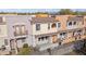 Townhome exterior with a private balcony, well-kept landscaping, and warm color palette at 10757 N 74Th St # 1016, Scottsdale, AZ 85260