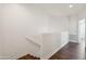 Bright hallway with wood floors, white walls and trim at 10757 N 74Th St # 1016, Scottsdale, AZ 85260