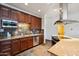 Modern kitchen with stainless steel appliances, granite countertops, and tiled backsplash at 10757 N 74Th St # 1016, Scottsdale, AZ 85260