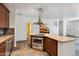 Modern kitchen with an island cooktop, granite counters, and stainless steel appliances at 10757 N 74Th St # 1016, Scottsdale, AZ 85260