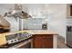 Open living area featuring fireplace, stone floors, and ample natural light at 10757 N 74Th St # 1016, Scottsdale, AZ 85260