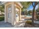 Community mailboxes near the pool featuring a stucco exterior and well maintained landscaping at 10757 N 74Th St # 1016, Scottsdale, AZ 85260