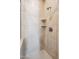 Shower featuring tiled walls, built-in corner shelves and bronze shower head at 10757 N 74Th St # 1016, Scottsdale, AZ 85260
