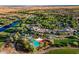 Aerial view of a golf course community showcasing lush landscaping, lakes, and luxurious amenities at 13207 W Duane Ln, Peoria, AZ 85383