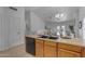 Well-appointed kitchen featuring wood cabinetry, modern appliances, and an adjacent dining area with an open concept layout at 137 W Gary Way, Gilbert, AZ 85233