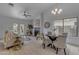 Inviting living room featuring neutral tones, a cozy fireplace, and an adjacent dining area for seamless entertaining at 137 W Gary Way, Gilbert, AZ 85233