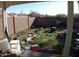 Backyard view showing lots of items and a brick wall at 13819 W Berridge Ln, Litchfield Park, AZ 85340