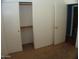 Bedroom featuring closet and entry door at 13819 W Berridge Ln, Litchfield Park, AZ 85340
