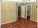 A bedroom showcasing closet and entry door at 13819 W Berridge Ln, Litchfield Park, AZ 85340