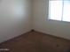 Bedroom featuring a window at 13819 W Berridge Ln, Litchfield Park, AZ 85340