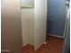 Walk in closet with sliding doors and a rod for clothing, great for storage and organization at 13819 W Berridge Ln, Litchfield Park, AZ 85340