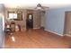 Spacious living room featuring wood-look flooring and neutral paint, offering a blank canvas for personalization at 13819 W Berridge Ln, Litchfield Park, AZ 85340