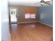Bright living room featuring wood-look floors and lots of natural light, creating a warm and inviting atmosphere at 13819 W Berridge Ln, Litchfield Park, AZ 85340