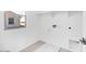 Bright laundry room with tile flooring, window and utility connections at 14634 W Sand Hills Rd, Surprise, AZ 85387