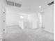 Bright living area with neutral carpet, lots of space, and stairs visible at 14634 W Sand Hills Rd, Surprise, AZ 85387