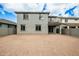Two-story home with covered patio and unfinished backyard with block wall at 18433 W Monte Lindo Ln, Surprise, AZ 85387