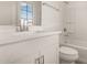 This bathroom features a bright white vanity and sink, toilet and shower-tub combo at 18433 W Monte Lindo Ln, Surprise, AZ 85387