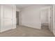 Bedroom showcasing carpeted floors and an ensuite bathroom at 18433 W Monte Lindo Ln, Surprise, AZ 85387