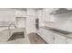 Close-up of kitchen with stainless steel appliances and gray countertops at 18433 W Monte Lindo Ln, Surprise, AZ 85387