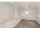 Spacious walk-in closet with carpet, built-in shelving, and hanging rods for ample storage at 18433 W Monte Lindo Ln, Surprise, AZ 85387