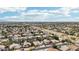 A distant aerial panorama of a diverse community showcasing landscaped homes with vibrant pools and a sprawling layout at 2032 E Sierra Madre Ave, Gilbert, AZ 85296