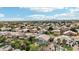 Wide aerial shot of an Arizona neighborhood featuring pools, mature landscaping, and tile roofs at 2032 E Sierra Madre Ave, Gilbert, AZ 85296