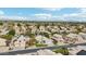 A landscape aerial shot of a housing community with landscaping and mountains on the horizon at 2032 E Sierra Madre Ave, Gilbert, AZ 85296
