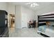 Bedroom featuring a modern tiled floor, desk area, and a bunk bed setup at 2032 E Sierra Madre Ave, Gilbert, AZ 85296