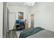 Bedroom with a desk featuring two monitors, chair and bed, perfect for a teenager or office at 2032 E Sierra Madre Ave, Gilbert, AZ 85296