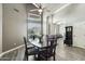 Open dining room with vaulted ceiling, abundant natural light, and view to living space at 2032 E Sierra Madre Ave, Gilbert, AZ 85296