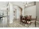 Spacious dining room featuring a chandelier, vaulted ceiling, and view to other rooms at 2032 E Sierra Madre Ave, Gilbert, AZ 85296