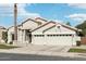 Attractive single-story home featuring a two-car garage, xeriscaping, and a covered front entrance at 2032 E Sierra Madre Ave, Gilbert, AZ 85296