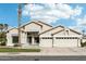 Charming single-story home featuring a two car garage, mature landscaping, and a welcoming front entrance at 2032 E Sierra Madre Ave, Gilbert, AZ 85296