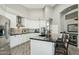 Bright kitchen with white cabinets, black countertops, stainless steel appliances, and modern faucet at 2032 E Sierra Madre Ave, Gilbert, AZ 85296