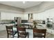 Kitchen boasting a large island with bar seating, stainless appliances, and white cabinets at 2032 E Sierra Madre Ave, Gilbert, AZ 85296