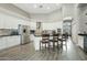 Modern kitchen featuring white cabinetry, stainless steel appliances, and a central island with bar seating at 2032 E Sierra Madre Ave, Gilbert, AZ 85296