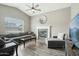 Comfortable living room featuring a fireplace, gray sectional sofa, and contemporary decor at 2032 E Sierra Madre Ave, Gilbert, AZ 85296