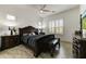 Luxurious main bedroom featuring a decorative headboard, ceiling fan, and bright windows at 2066 N Canelo Hls, Mesa, AZ 85207