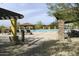 Community pool with shaded seating areas and lounge chairs for residents to relax and enjoy at 2066 N Canelo Hls, Mesa, AZ 85207