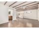 Bright living room with exposed beam ceilings, concrete floors, and modern fixtures at 2218 N Dayton St, Phoenix, AZ 85006