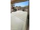 View of the concrete back patio and metal fencing at 23167 W Lasso Ln, Buckeye, AZ 85326