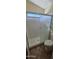 Bathroom with a glass-enclosed shower, toilet, and tile flooring at 23167 W Lasso Ln, Buckeye, AZ 85326