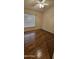 Bedroom featuring wood flooring, neutral walls, and blinds on the window at 23167 W Lasso Ln, Buckeye, AZ 85326