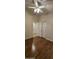 Bedroom with wood flooring, neutral walls, and a ceiling fan at 23167 W Lasso Ln, Buckeye, AZ 85326