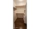 This closet includes white shelving and laminate flooring at 23167 W Lasso Ln, Buckeye, AZ 85326