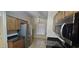 Efficient kitchen space with stainless steel fridge, built-in microwave, and granite countertops at 23167 W Lasso Ln, Buckeye, AZ 85326