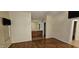Spacious main bedroom with wood flooring and a connected bathroom featuring double sinks at 23167 W Lasso Ln, Buckeye, AZ 85326