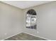 Bedroom with wood-look flooring and a bright window at 26 S Tiago Dr, Gilbert, AZ 85233