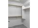 Walk-in closet with ample storage space, shelving, and hanging rods at 26 S Tiago Dr, Gilbert, AZ 85233