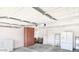 Clean garage interior with cabinet space, ample lighting, and storage options at 26 S Tiago Dr, Gilbert, AZ 85233